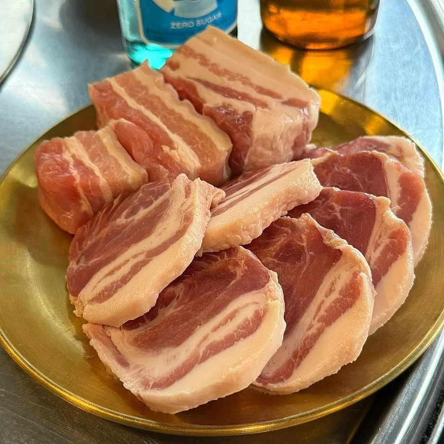 Raw pork belly and cheek-neck cut on a plate