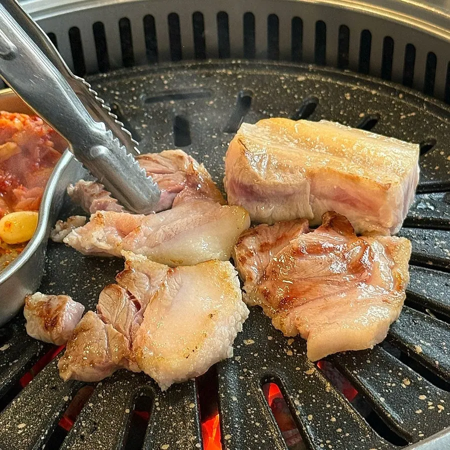Specialty pork cuts grilling to a golden brown