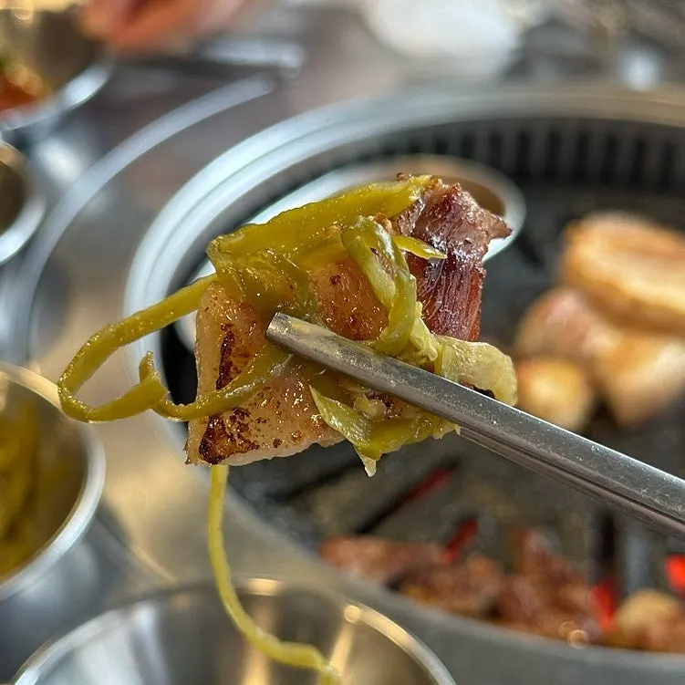Cheek-neck cut topped with pickled peppers and wasabi