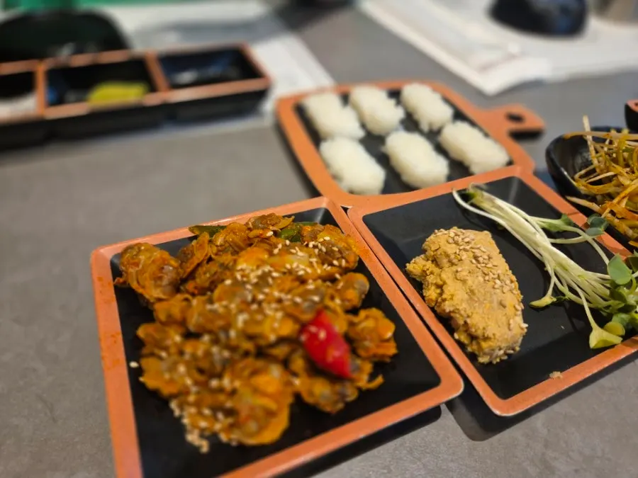 Side dishes and anglerfish liver salad table setting