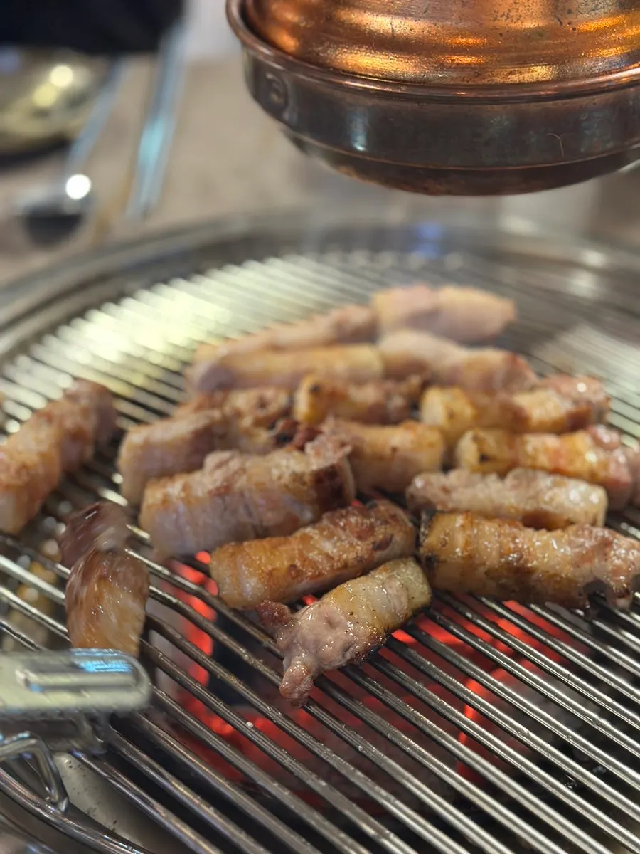 A full meat spread with a Coke