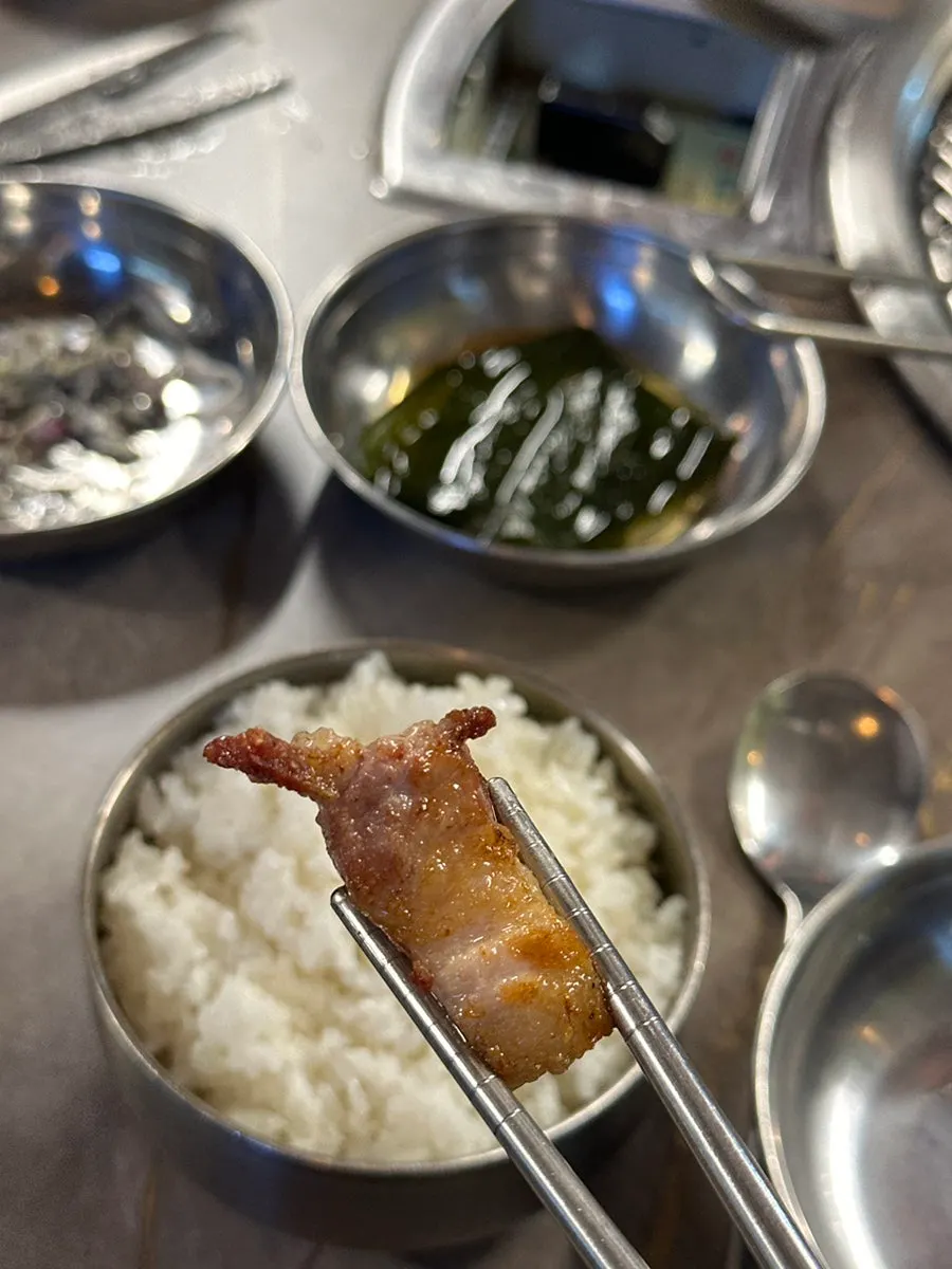 Close-up of whole pork belly and side dishes