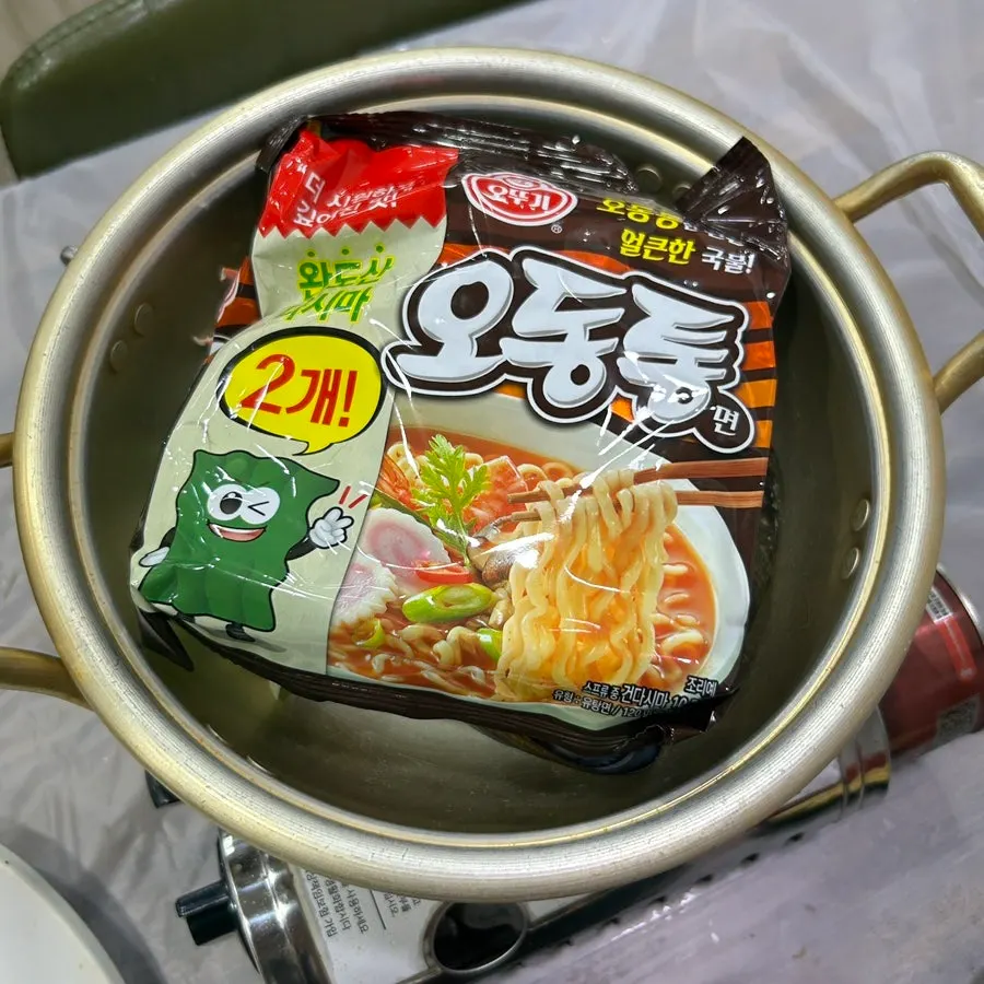 Seafood ramyeon boiled in a metal pot