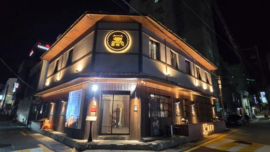 Exterior of Donbegi Gwang-an Branch lit up at night