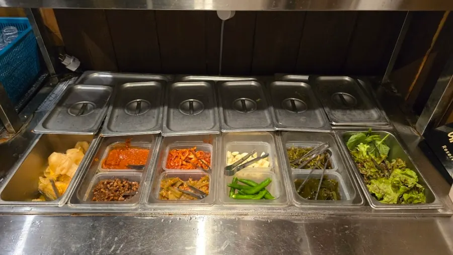 Self-serve bar on the 2nd floor with side dishes and lettuce wraps