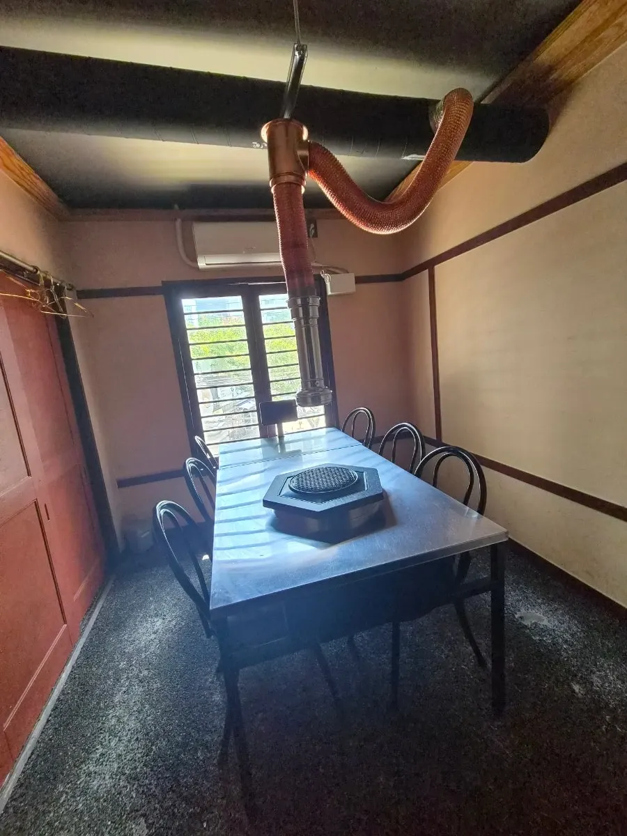 Corridor of numbered rooms hung with black noren curtains