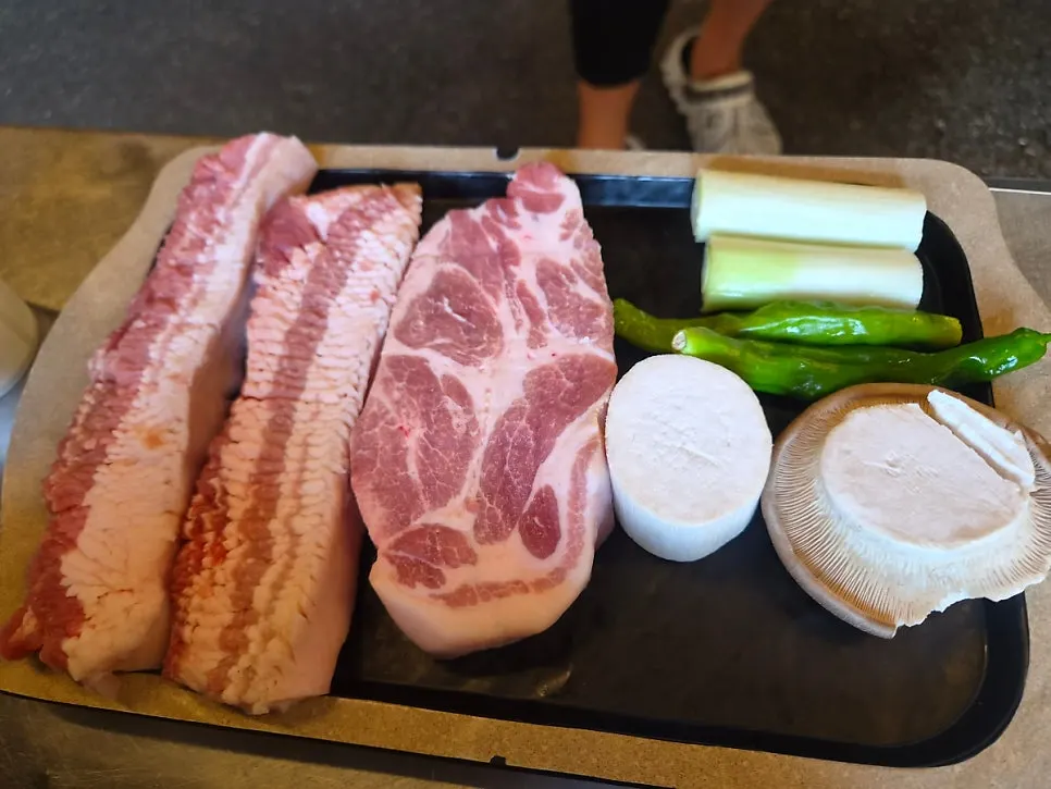 A plate of 480-hour aged snowflake pork belly and pork shoulder