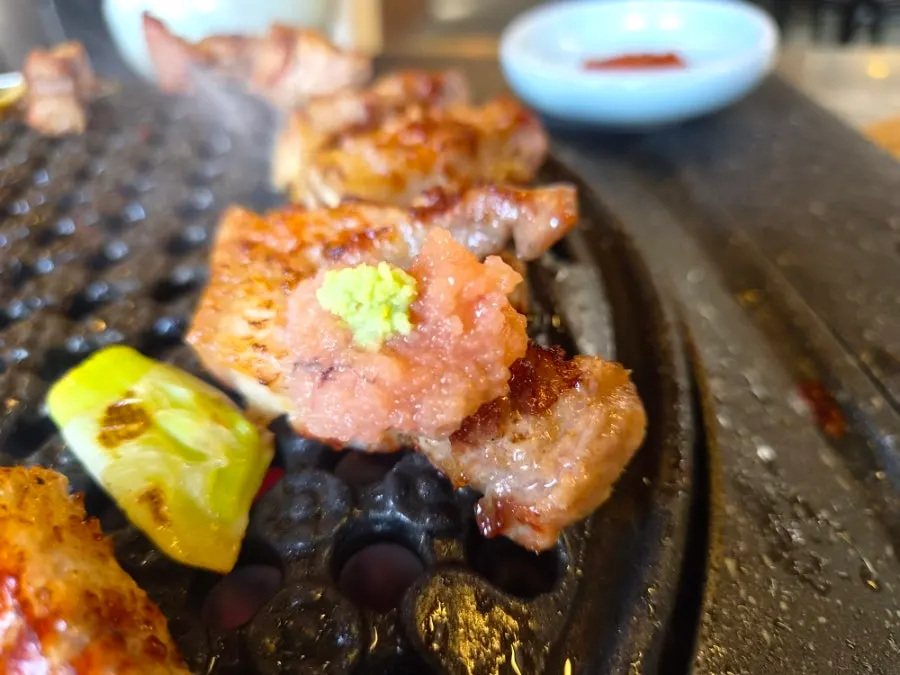Pork belly topped with salted pollack roe and wasabi