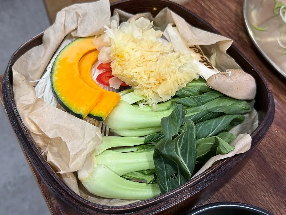 Vegetable plate with sweet pumpkin, bok choy, and mushrooms served with the bulgogi