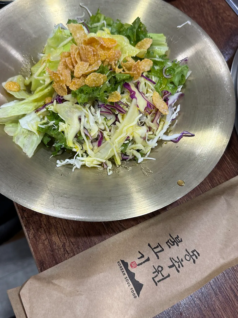 Salad served with individually wrapped utensils