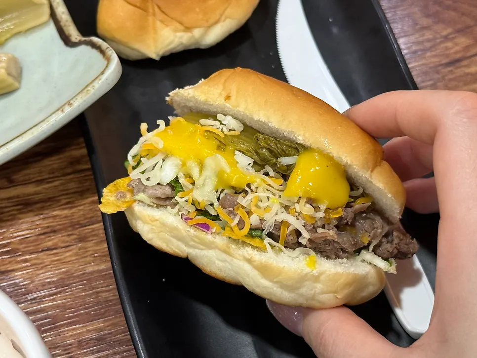 A bulgogi burger made with morning buns and bulgogi