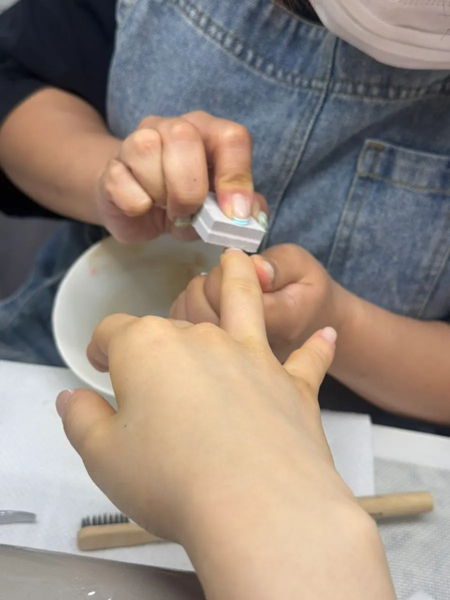 Nail care while watching a phone