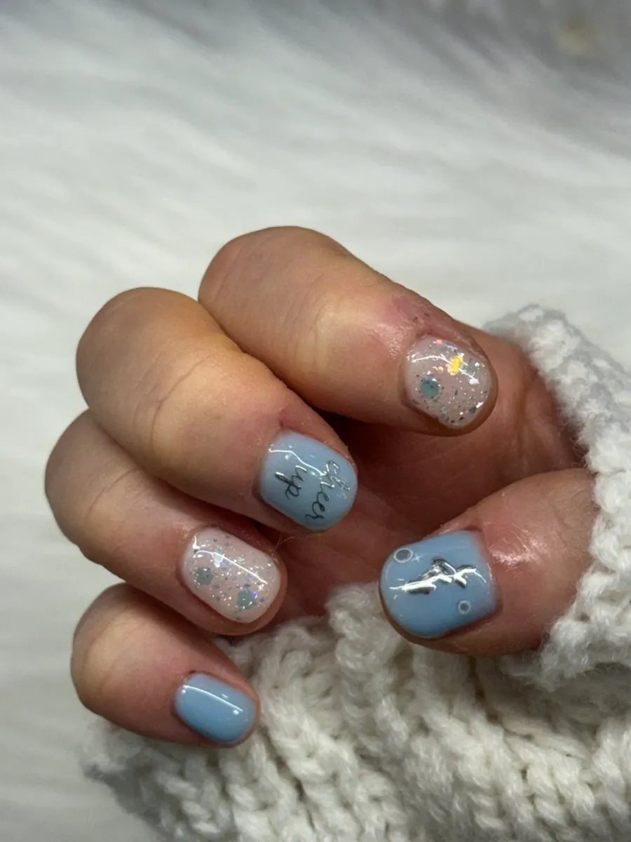 Mermaid-princess nails changed to sky blue