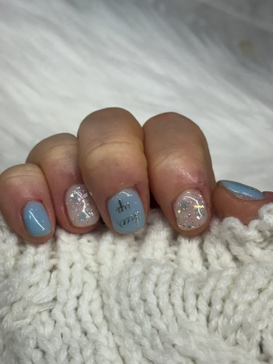 Nails with a cheer up sticker