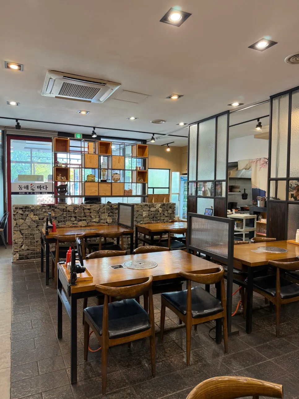 Spacious, clean interior of the sashimi restaurant hall