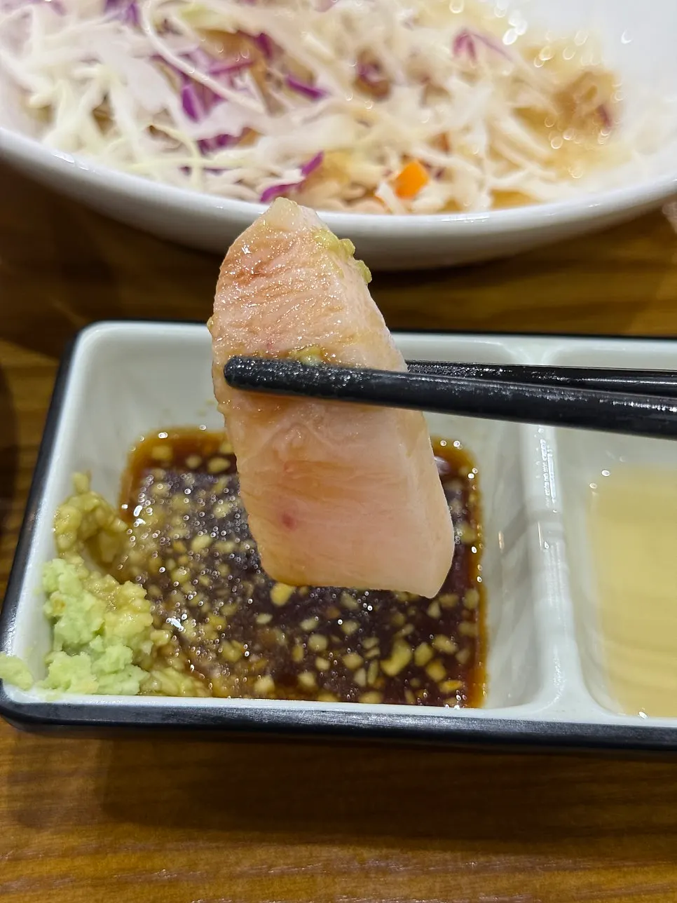 Glossy portion of tuna sashimi