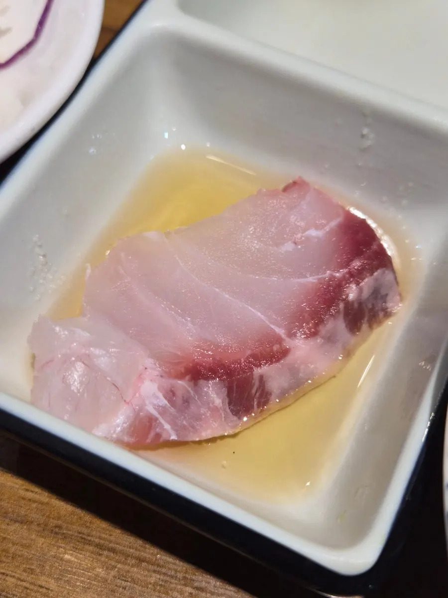 Plate of thickly sliced assorted sashimi