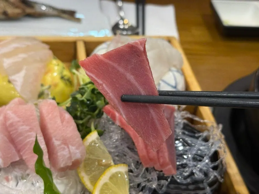 Mixed sashimi set for two served on a wooden tray