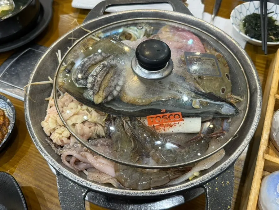 Mixed sashimi plate partly eaten down