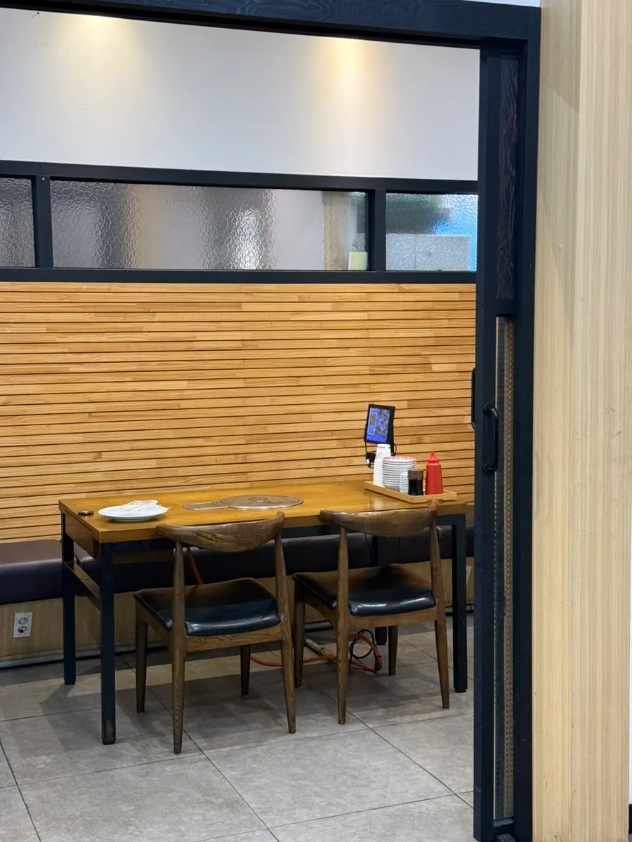 Table set for two with mixed sashimi and seafood stew together