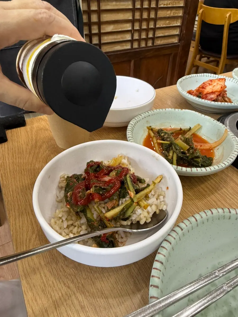 Complimentary barley rice and house-made side dishes