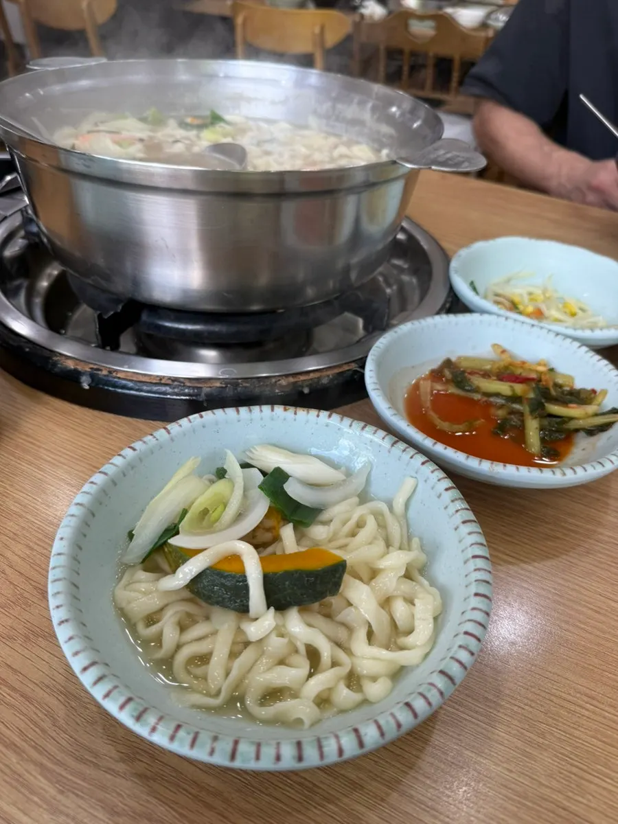 Seafood kalguksu in clam broth