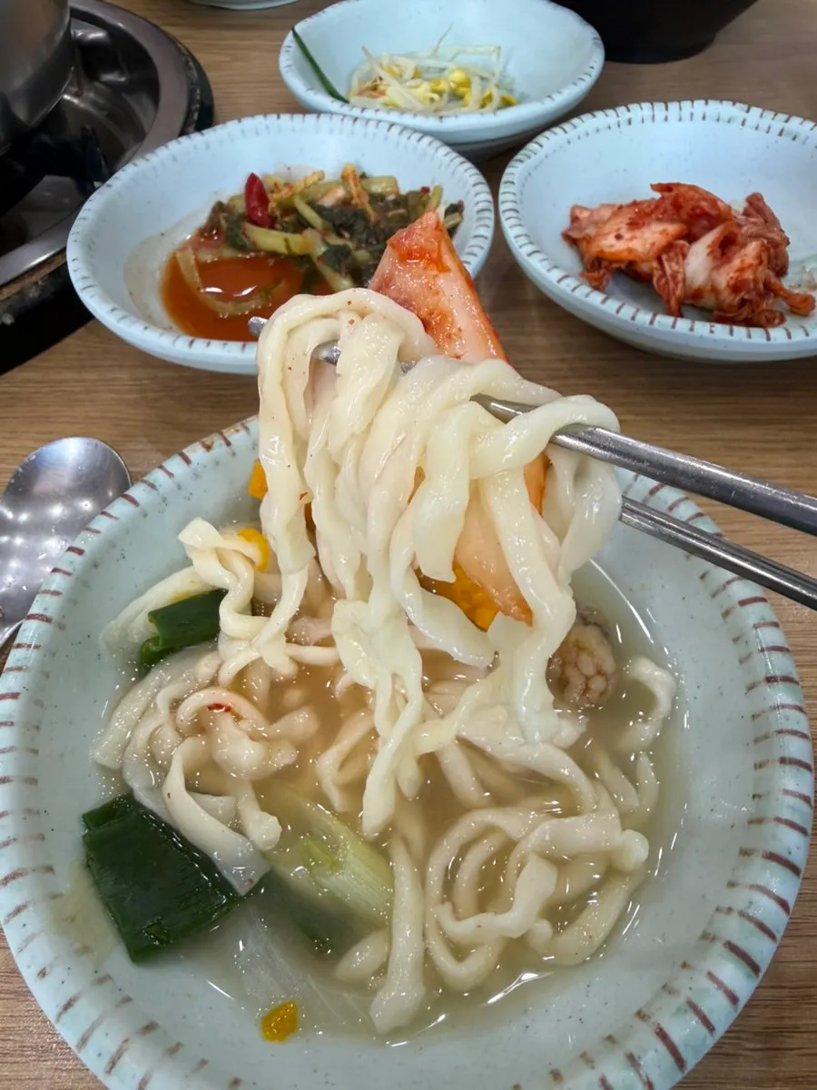 Chewy kalguksu noodles scooped out before softening