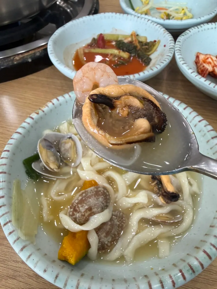 Seafood kalguksu noodles and broth