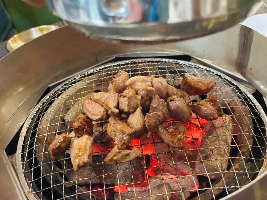 A bite of meat wrapped with greens