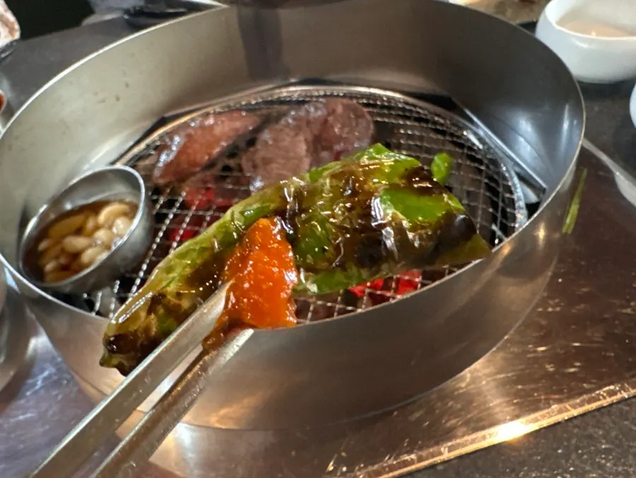Kkwari gochu peppers grilled alongside the brisket
