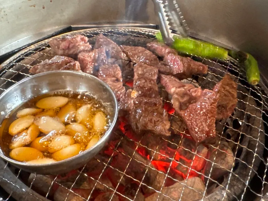 Peppers and meat on the charcoal grill