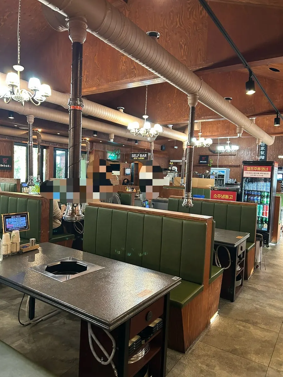 Dining hall with charcoal grill tables