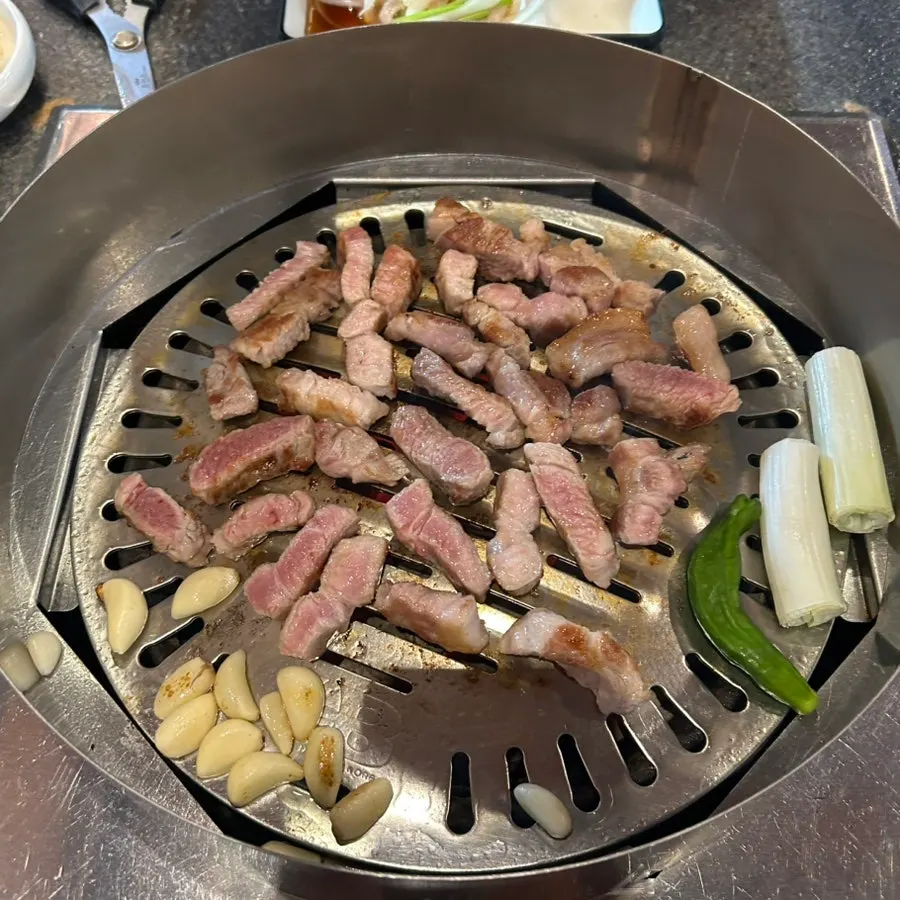 Meat cooking on the charcoal grill