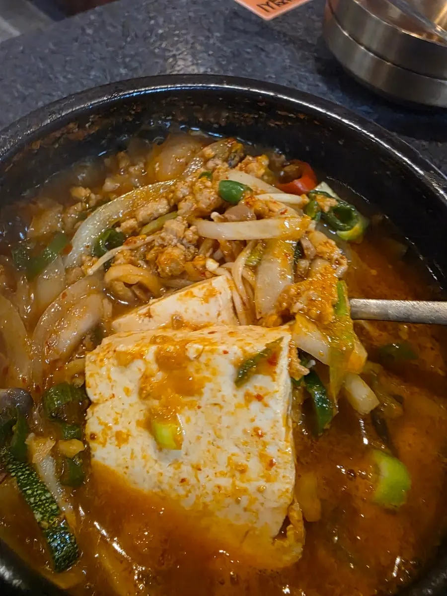 Table set with hanwoo doenjang sultbap and bowls of rice