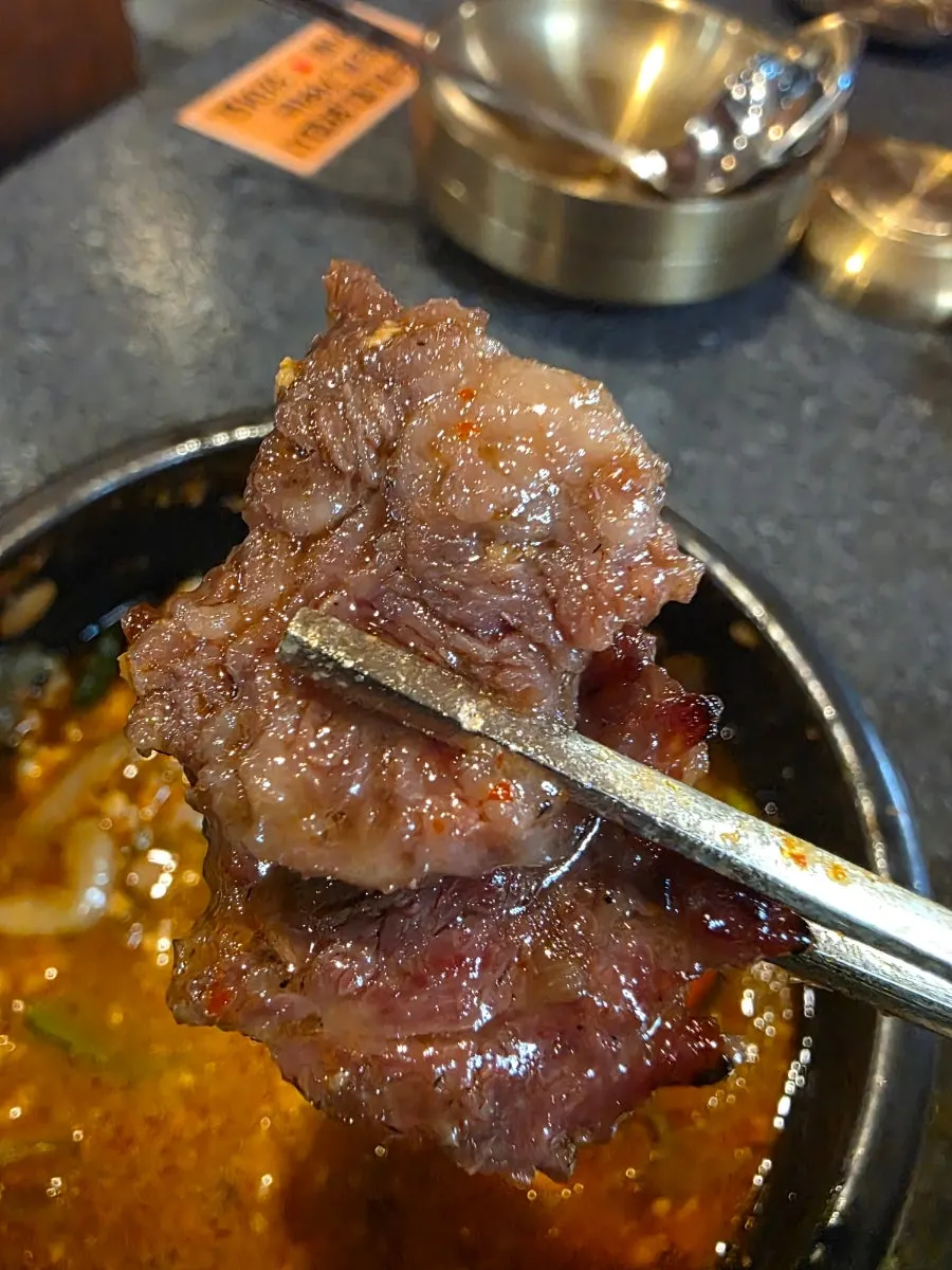 Cross-section of grilled hwangjesal showing mostly lean meat