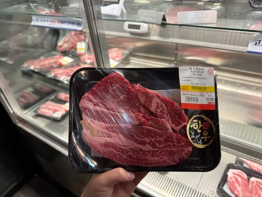 Refrigerated meat display case at Dongbaek Hanokjip where you pick your own cut