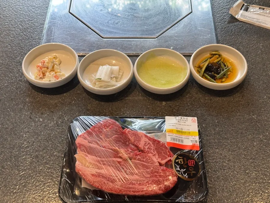 Basic table setting with salad and geotjeori side dishes