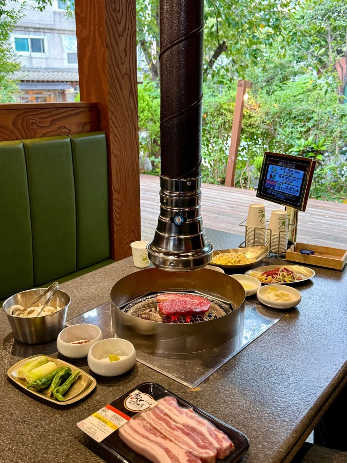 Charcoal-grilled meat spread at Dongbaek Hanokjip Charcoal Grill Butcher Restaurant