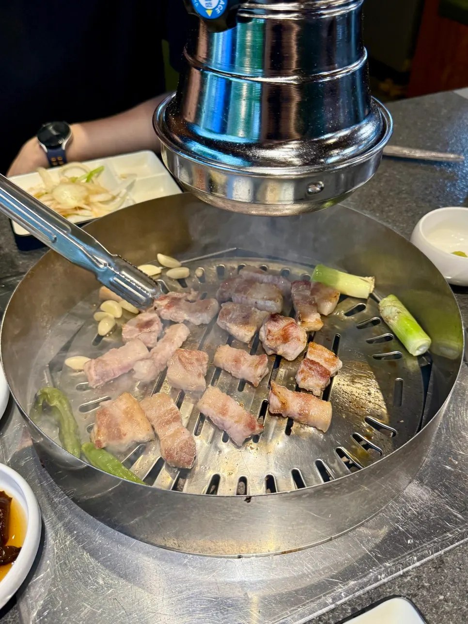 Meat cooking on the charcoal grill