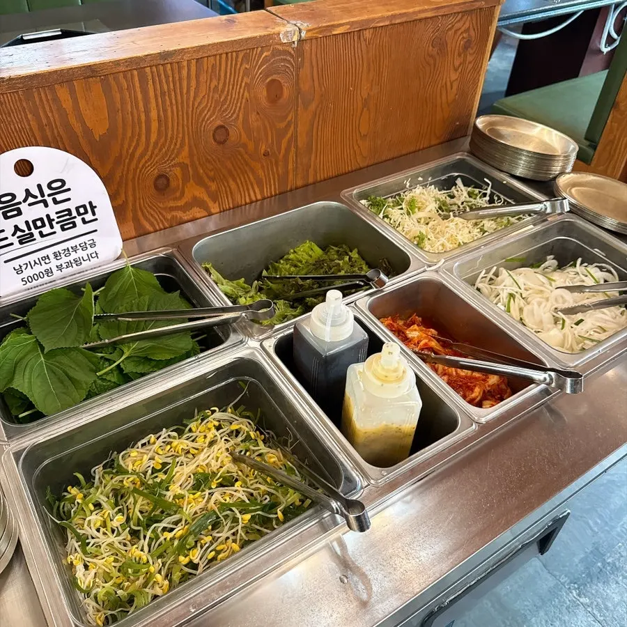 Kimchi and pickled green onion at the self-serve bar