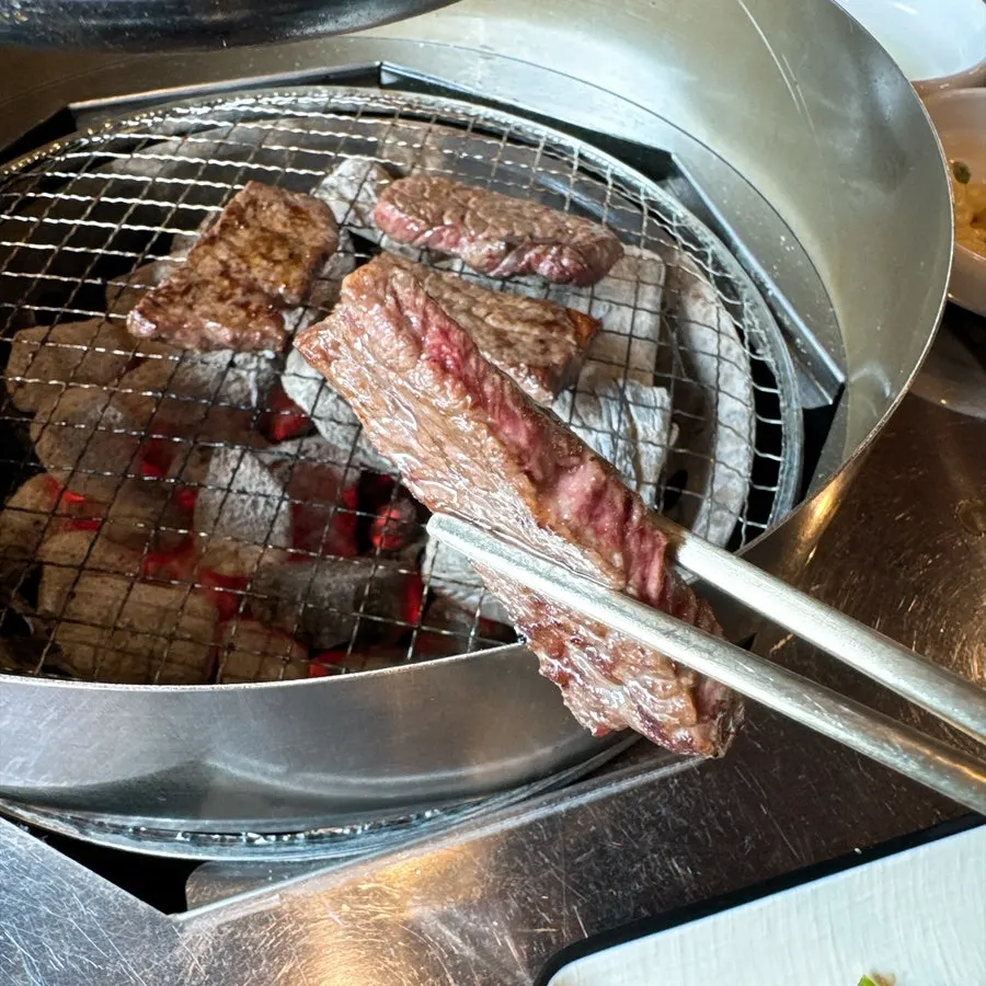 Hanwoo lower sirloin placed on the charcoal grill