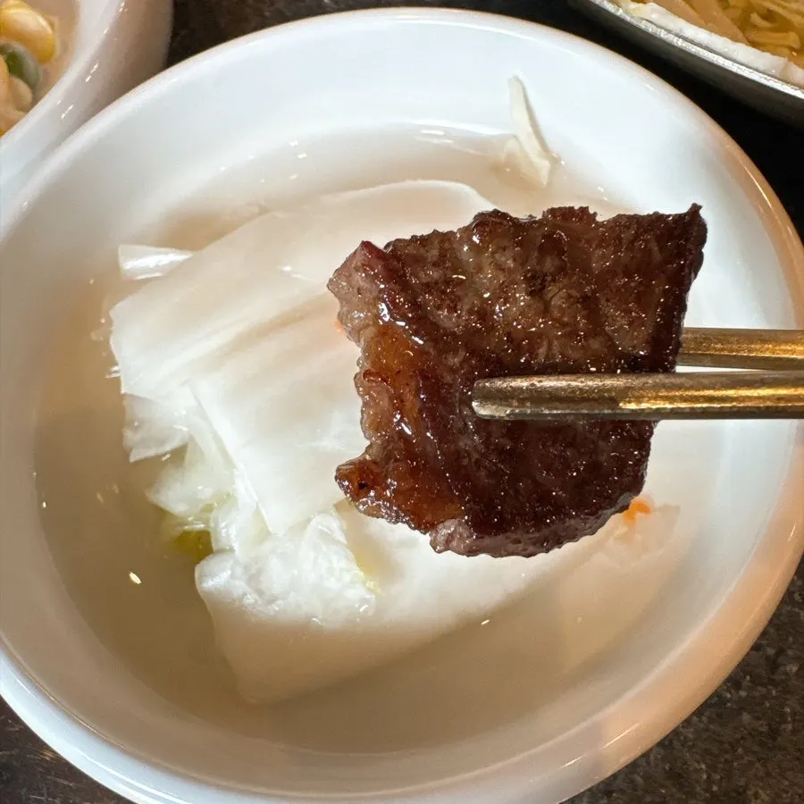 A piece of hanwoo paired with pickled onion