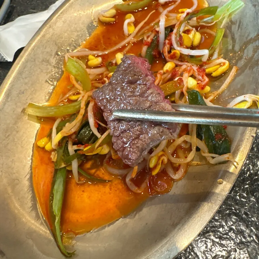 Charcoal-grilled hanwoo eaten with pickled green onion