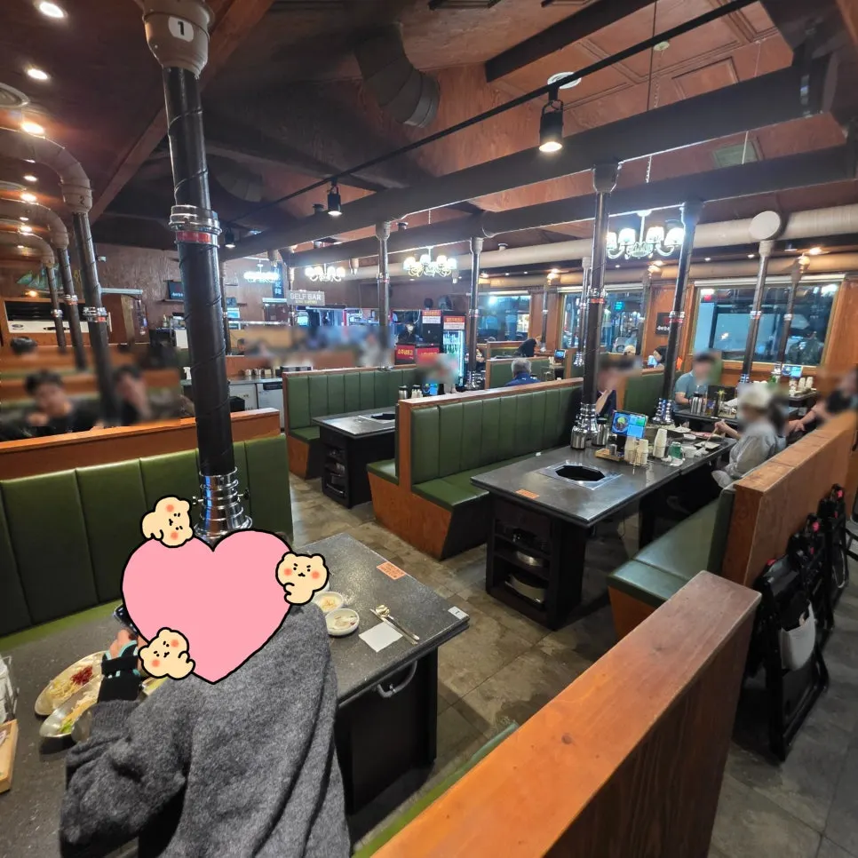 Spacious interior seating at Dongbaek Hanokjip