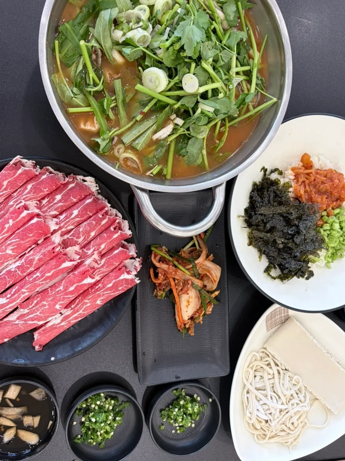 Table set with sirloin and kimchi