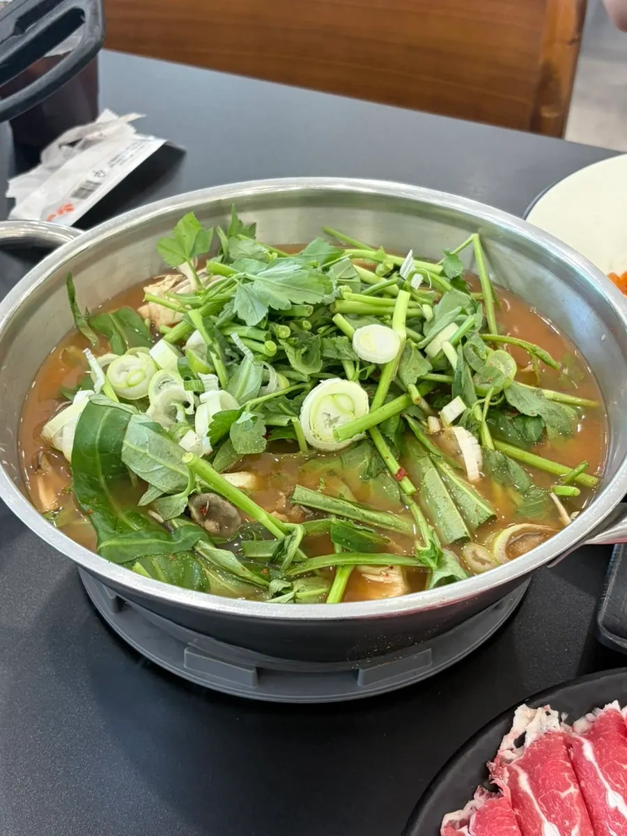 Kalguksu ingredients with kimchi, minari, and seaweed