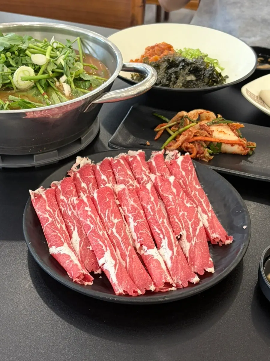 A generously loaded shabu-kalguksu spread for two