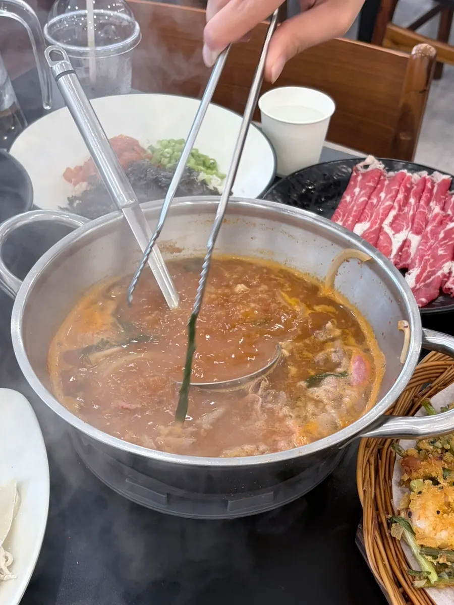 Kalguksu noodles cooking in the broth