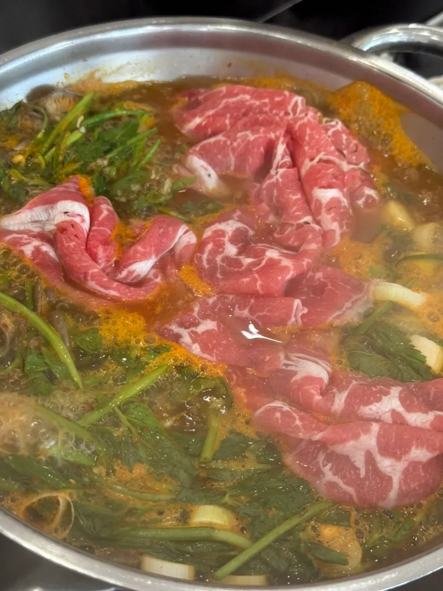Flat kalguksu noodles cut by staff