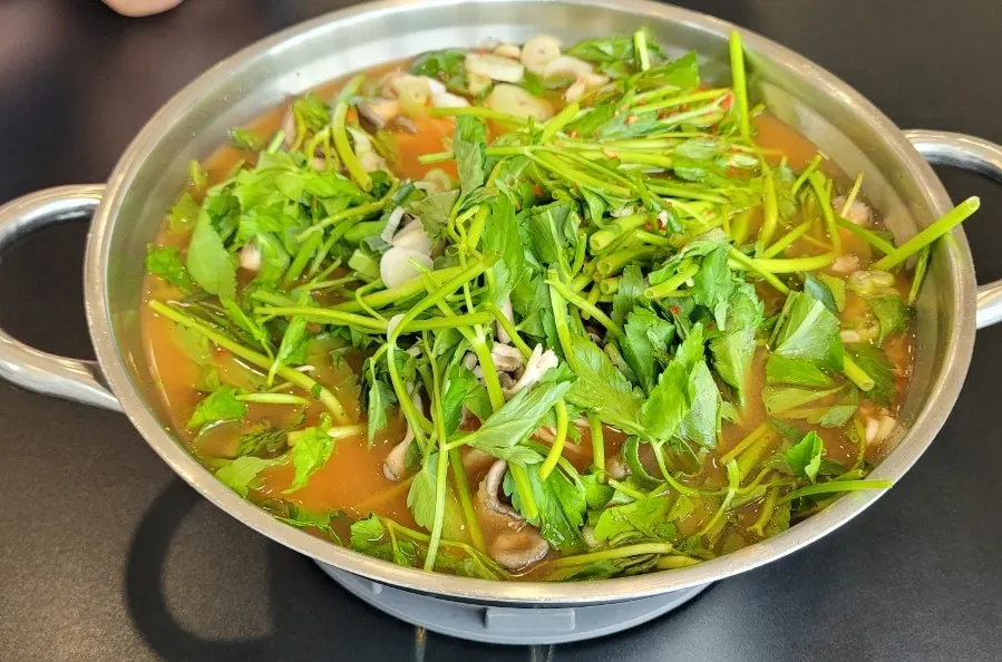 Red broth pot starting to boil